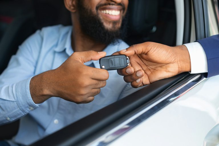 Car Renting. Male Driver Taking Keys From Manager, Sitting In Rental Auto